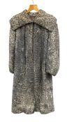 A vintage ladies French mottled grey Astrakhan lamb fur coat by Ch. Salganik with maker's label.