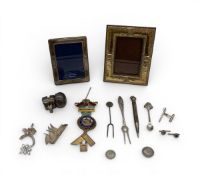 A mixed collection of silver and white metal items.