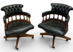 A pair of 19th century style leather upholstered captain's chairs with tilt and swivel action. H.