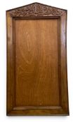 A vintage teak frame with hand carved pitched pediment and simple surround. H.130 W.70cm