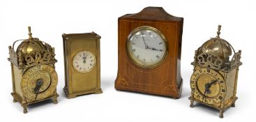 Two vintage brass lantern clocks together with and Edwardian mantle clock and an automatic brass