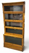 An early 20th century light oak Globe Wernicke bookcase in five sections with maker's plaques. H.188