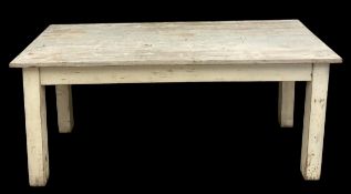 A painted and distressed pine kitchen table on square section supports. H.77 W.180 D.76cm