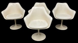 After Eero Saarinen, a set of four tulip armchairs with leather cushions and swivel action. H.80 W.