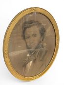 A 19th century charcoal portrait of a gentleman in a glazed, gilt oval frame. H.57 W.47cm