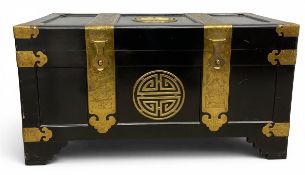 A vintage Chinese black lacquered and brass bound camphorwood trunk or chest. H.48 W.90 D.46cm