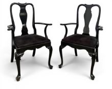 A pair of ebonised lacquered early Georgian style armchairs with drop-in seats on cabriole supports.