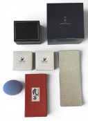 A mixed lot to include a Swarovski leaf brooch and clip-on earrings, a set of ceramic Mikimoto