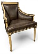 A painted Empire style armchair in faux leather upholstery raised on tapering fluted supports. H.