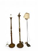 Two vintage carved giltwood standard lamps and a vintage metal reading lamp with adjustable height