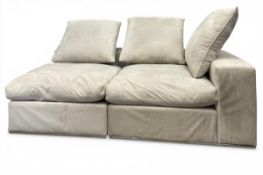 A contemporary two section corner sofa in faux suede upholstery. H.55 W.180 D.107cm