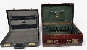 An early 20th century crocodile skin vanity case along with a vintage leather attache case.