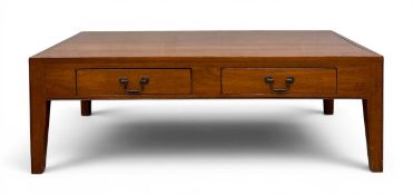 A contemporary hardwood coffee table with two frieze drawers raised on tapered square section