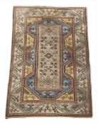 A Caucasian Oushak style carpet with a foliate field over the oat ground within multiple geometric