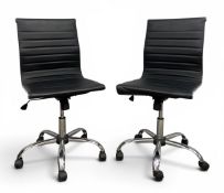 A pair of contemporary Eames style office chairs each with ribbed leatherette back and seat with
