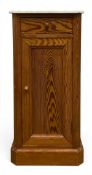 A C.1900 pitch pine bedside pot cupboard or side cabinet with square white marble top over the