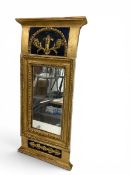 A 19th century Swedish Gustavian style pier mirror with shaped pediment and carved giltwood