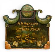 A C.1900 carved and painted wall hanging sign inscribed, 'H.M. Dockyard Chatham Charts Room'. H.