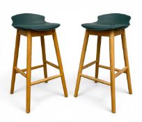 A pair of contemporary bar stools each with a green leatherette upholstered composite moulded seat