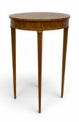 A 19th century Louis XVI style walnut occasional table with circular marquetry inlaid top raised