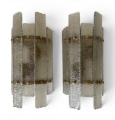 A pair of contemporary Eichholtz wall sconces each with faceted handblown textured Murano smoked