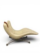 A contemporary De Sede DS-151 chaise longue with a cream leather curvilinear seat and tan adjustable