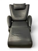A contemporary De Sede DS-260 black leather recliner armchair with a shaped back and arms over the