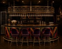 A contemporary bespoke 1920s American prohibition style speakeasy bar, having a brass openwork