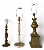 Two vintage brass baluster form table lamps together with an onyx example. H.64cm largest
