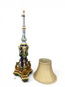 A vintage cast and cold painted full height metal standard floor standing lamp having a Neoclassical