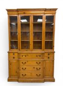 A mid-century breakfronted Drexel pine sectretaire library bookcase in two parts having a dentil