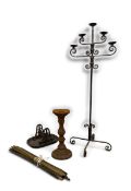 A floor standing five branch iron candelabra, a cast iron candlestick, a similar bootscraper and a
