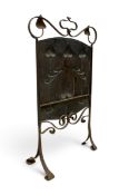 A 19th century Art Nouveau embossed copper fire screen along with two pairs of similar fire dogs.