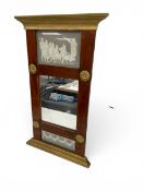 A 19th century style pier mirror with classical decorated frieze in a giltwood and mahogany frame.