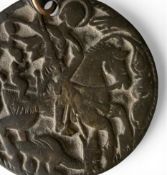 A bronze medallion depicting St. George slaying the dragon, possibly 18th century Russian. 6cm