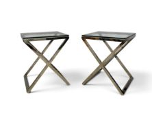 A pair of contemporary ZENN stainless steel and plate glass lamp tables on X-frame supports. H.66