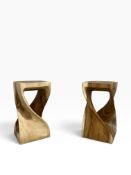 A pair of hand carved acacia twist stools or lamp tables. H.51 x W.27 x D.27cm