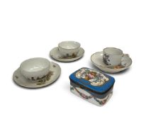 A pair of 19th century German hand painted cups and saucers, a similar coffee cup and saucer and a