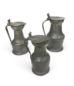 A collection of three 18th century pewter lidded jugs. H.28cm, tallest.