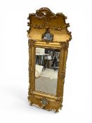 A 19th century giltwood and gesso pier mirror with arched pediment above original plate with foliate