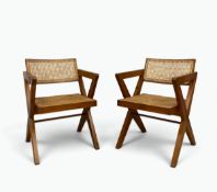 In the manner of Pierre Jeanneret, a pair of teak and rattan armchairs on X-frame. H.76 x W.53 x D.