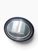 An Edwardian oval wall mirror. H 68cm x W 49cm