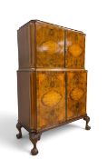 A mid century burr walnut early Georgian style drinks cabinet with mirrored and fitted upper section