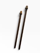 Two curtain poles with acorn finials L 130 and 150cm.