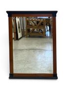 A walnut and ebonised Empire style pier mirror. H.105 x W.76cm