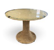 A mid century woven wicker pedestal dining table with plate glass top by Marzio Cwcchi for Studio