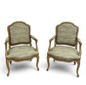A pair of Louis XV style painted frame open armchairs in studded striped calico. H.95 x W.68 x D.