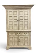 A full height painted pantry cupboard in the 19th century Continental style with panel doors