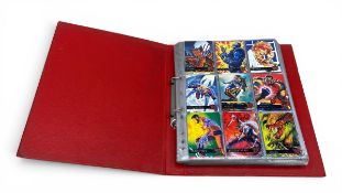 A set of vintage collectible 1990s Fleer basketball and X-Men cards.