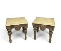 A pair of contemporary Italian carved and painted side or lamp tables with painted faux marble tops.